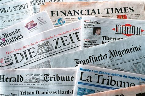on newspaper or in newspaper.